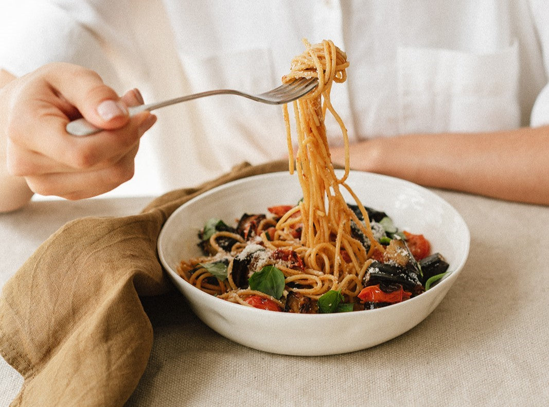 At the table:  Aubergine, fresh tomato + pesto spaghetti